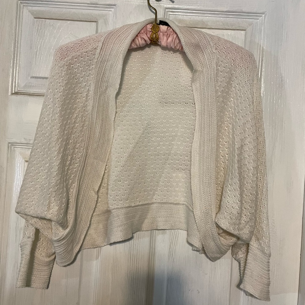 White bat wing shrug.